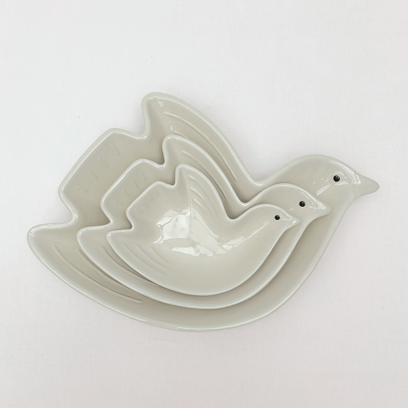 Cuenco pío pájaro arena pm L16,2 P11 H3cm